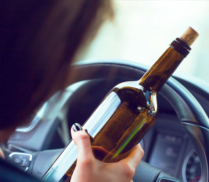 A female drinking while driving